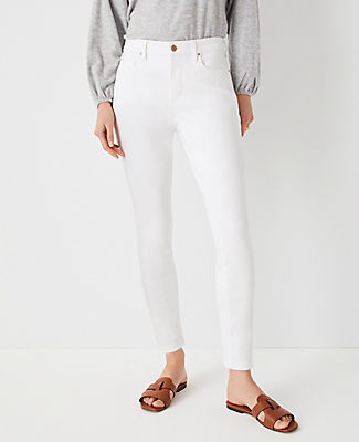 Ann Taylor Sculpting Pocket Mid Rise Skinny Jeans in White - ShopStyle