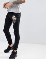 Thumbnail for your product : Religion skinny fit biker jeans in black with skeleton patches