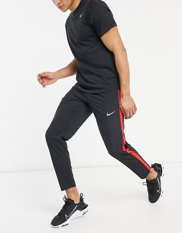 Nike Running Run Stripe joggers in black - ShopStyle Activewear Trousers