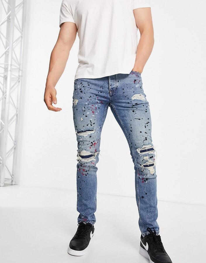 Topman stretch skinny rip and repair paint splat jeans in mid wash blue -  ShopStyle