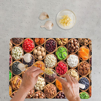 kayra export Stylish Glass Chopping Board Featuring a Modern Depiction of a Chopping Board Laden with Fresh Fruits and Nuts
