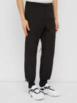 Thumbnail for your product : Prada Hammered Nylon Zipped-cuff Trousers - Mens - Black