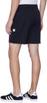Thumbnail for your product : Reigning Champ 'Shield' logo print mesh panel track shorts