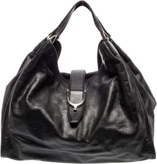 Gucci Hobo Black Leather Silver-Tone Hardware Dual Shoulder Straps Logo Jacquard Lining & Three Interior Pockets Flap Closure at Front Unfortunately due to restrictions this item may not be eligible for shipping in all areas.