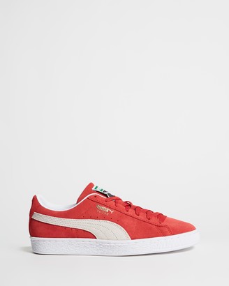 red and white puma trainers