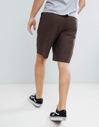 ASOS DESIGN slim longer shorts in dark brown