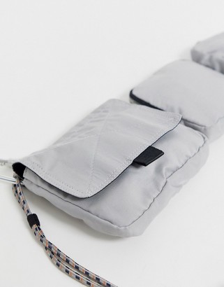 ASOS multi pocket cross body bag in silver