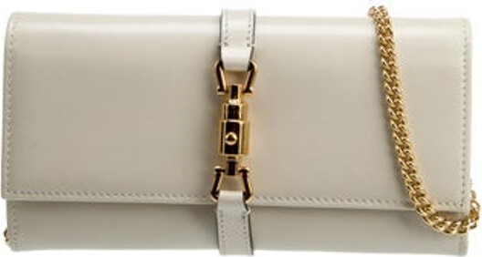 Gucci Crossbody Bag Neutrals Leather Piston Lock Accent Gold-Tone Hardware Chain-Link Shoulder Strap Chain-Link Accents Faille Lining & Four Interior Pockets with Card Slots Push-Lock Closure at Front Includes Box & Dust Bag Unfortunately due to restrictions this item may not be eligible for shipping in all areas.