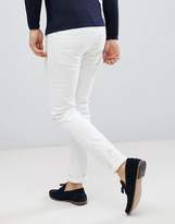 Thumbnail for your product : ASOS DESIGN skinny jeans in white with knee rips