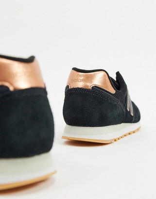 New Balance 373 sneakers in black and rose gold - ShopStyle