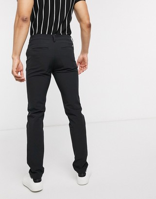 Calvin Klein Golf Genius pants in black - ShopStyle Chinos & Khakis