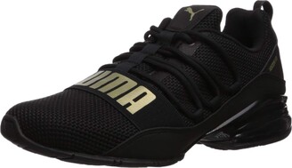 puma gold and black shoes