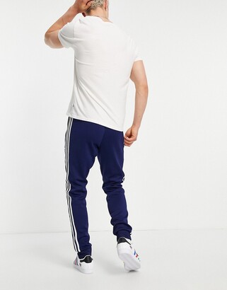 adidas adicolor classics SST joggers in navy - NAVY - ShopStyle Trousers