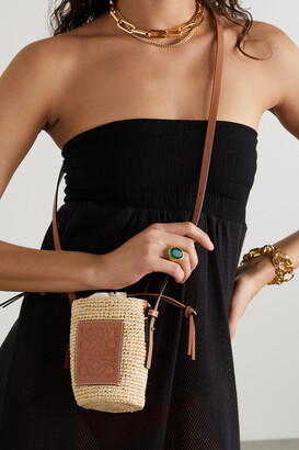 + Paula's Ibiza leather-trimmed raffia bucket bag