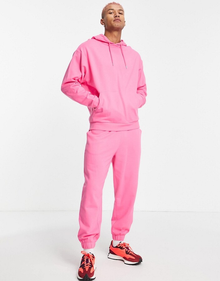 ASOS DESIGN tracksuit with oversized hoodie and oversized sweatpants in pink  - PINK - ShopStyle Activewear Pants