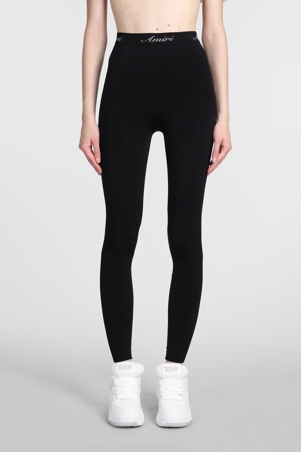 https://img.shopstyle-cdn.com/sim/7e/50/7e5006dc3774e2f446280bd39c8d2329_best/amiri-leggings-in-black-polyamide.jpg