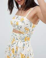 Thumbnail for your product : ASOS Design DESIGN cami playsuit with cut out detail in linen in floral print