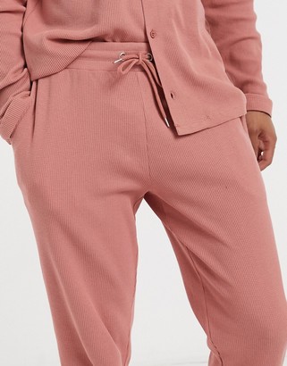 ASOS DESIGN tapered trackies with fixed hem in pink waffle