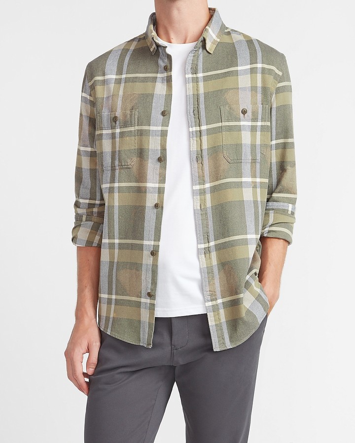 dark green shirt and blue jeans