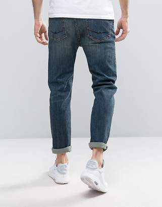 ASOS Design Tapered Jeans In Dirty Blue Wash