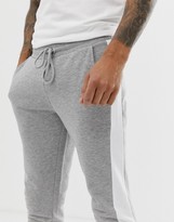 Thumbnail for your product : ASOS DESIGN skinny joggers with side stripe in grey marl
