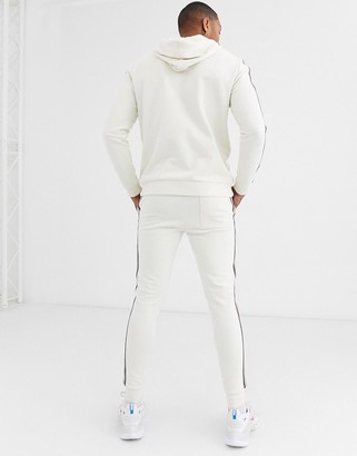 ASOS DESIGN tracksuit with hoodie and side stripe in beige