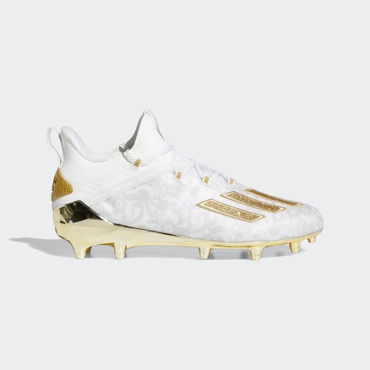 white and gold vapor cleats