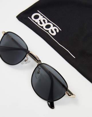 ASOS Design 90S Small Oval Sunglasses In Black With Silver Metal Nose Bridge