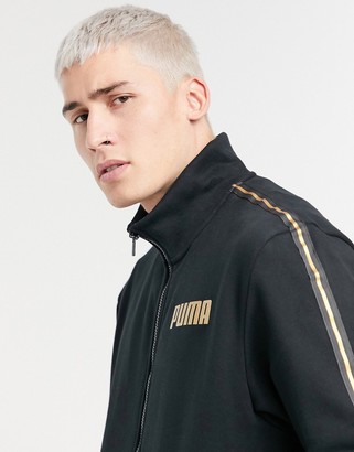 Puma track jacket in black with gold taping