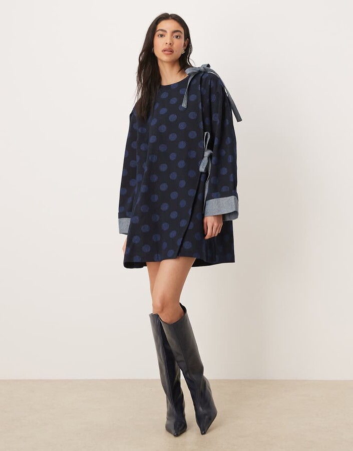 GHOSPELL exclusive denim bow detailing boxy mini dress in polka dots