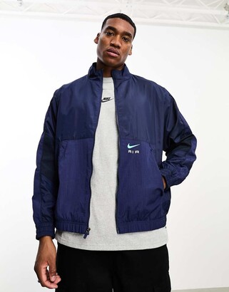 nike zip up track jacket