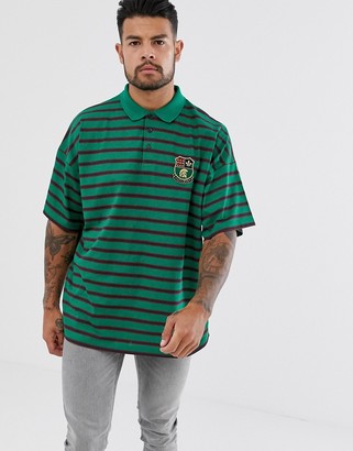 ASOS DESIGN oversized striped polo with emblem