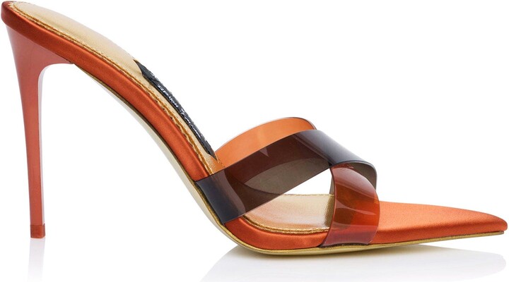 JESSICA RICH This iconic line of must-have heels blends elegance with modern flair, offering the perfect statement piece for any wardrobe. The Coco Mule, designed for this collection, offers a fresh take on our mule design. Featuring a criss-cross PVC toe straps make this the sexiest mule yet!