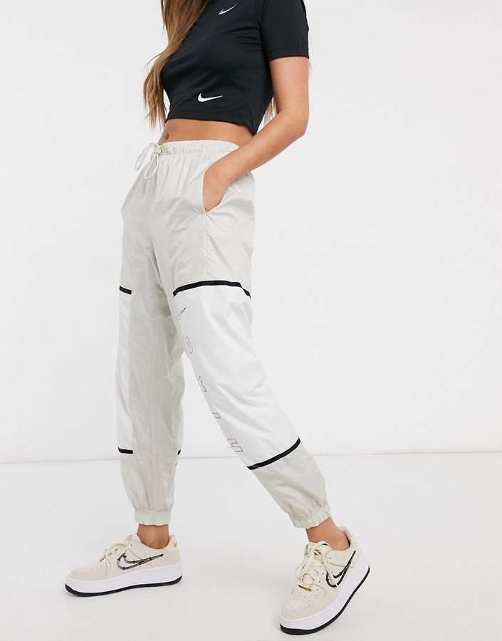 Nike color block woven sweatpants in cream - ShopStyle Activewear Pants