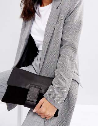 ASOS DESIGN leather and suede tab front clutch bag