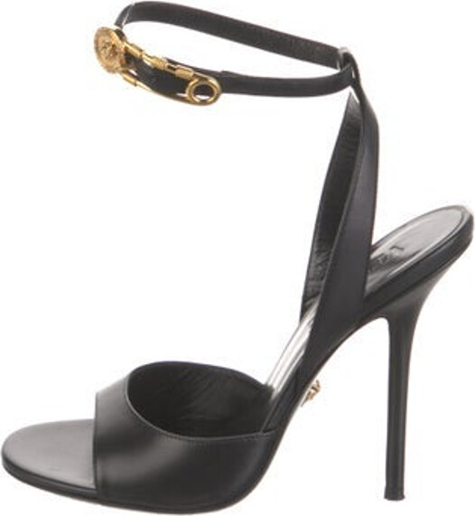 Versace Leather Sandals Black Medusa Insignia Wrap-Around Straps & Buckle Closure at Ankles Unfortunately, due to restrictions, this item may not be eligible for shipping in all areas.