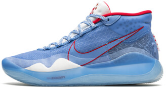 two different color nike shoes