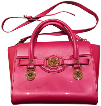 Versace Pink Patent leather Handbags - ShopStyle Bags