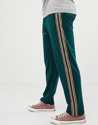 ASOS DESIGN retro track tapered sweatpants with side stripes