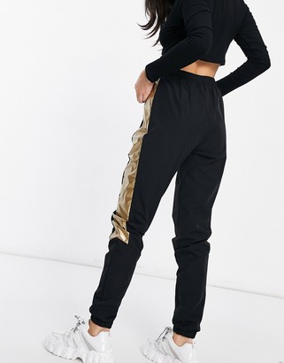 Ellesse track pants in black and gold- exclusive to ASOS - ShopStyle