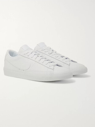 white leather nike shoes