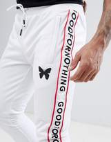 Thumbnail for your product : ASOS Good For Nothing Skinny Joggers In White With Logo Side Stripes Exclusive to