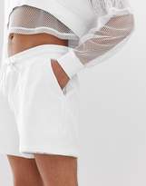 Thumbnail for your product : ASOS DESIGN two-piece jersey relaxed shorts with mesh overlay in white