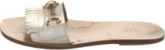 Gucci Leather Slides White Horsebit Accent Fringe Trim Accent Unfortunately, due to restrictions, this item may not be eligible for shipping in all areas.