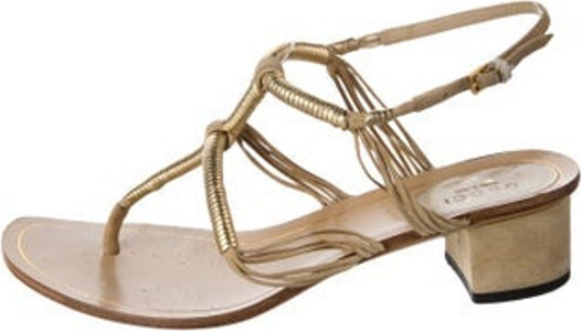 Gucci Leather T-Strap Sandals Brown & Metallic Leather Trim Embellishment Wrap-Around Straps & Buckle Closure at Ankles Unfortunately, due to restrictions, this item may not be eligible for shipping in all areas.