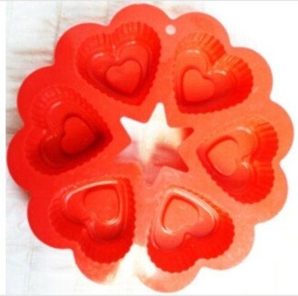 https://img.shopstyle-cdn.com/sim/86/03/8603d2a109962621e1deba6102a878dd_xlarge/red-silicone-heart-circle-shaped-cake-baking-mold.jpg