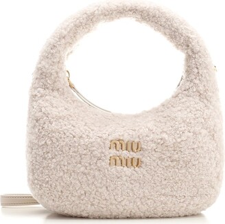 Miu Mius had this style of bag out for awhile and it was Dooney who in fact  copied Miu Miu, Loewe Anagram Tote 394876