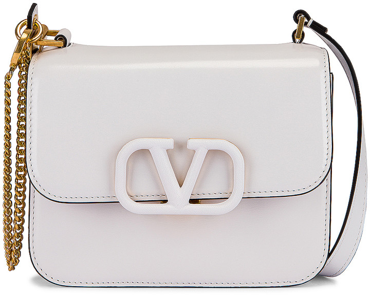 Valentino Garavani Small VSling Shoulder Bag in Bianco Ottico | FWRD -  ShopStyle