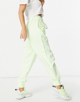 Nike Swoosh woven joggers in neon yellow - ShopStyle Activewear Pants