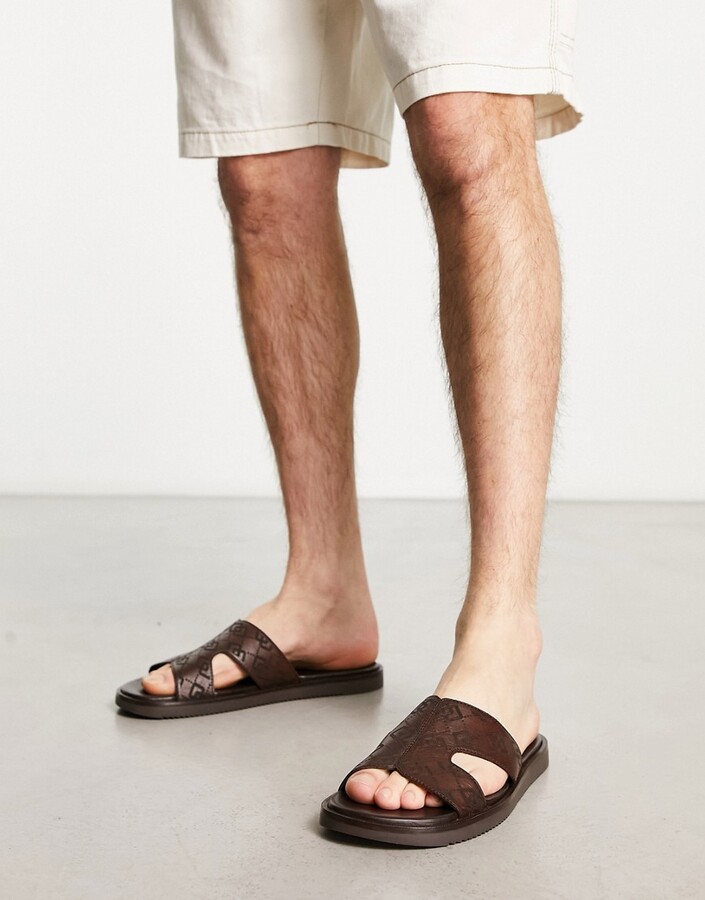 ASOS DESIGN slip on sandals in brown monogram print - ShopStyle